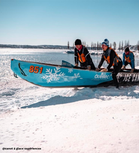 Ice canoeing on the St. Lawrence River in winter, with ice floes and partially frozen water
