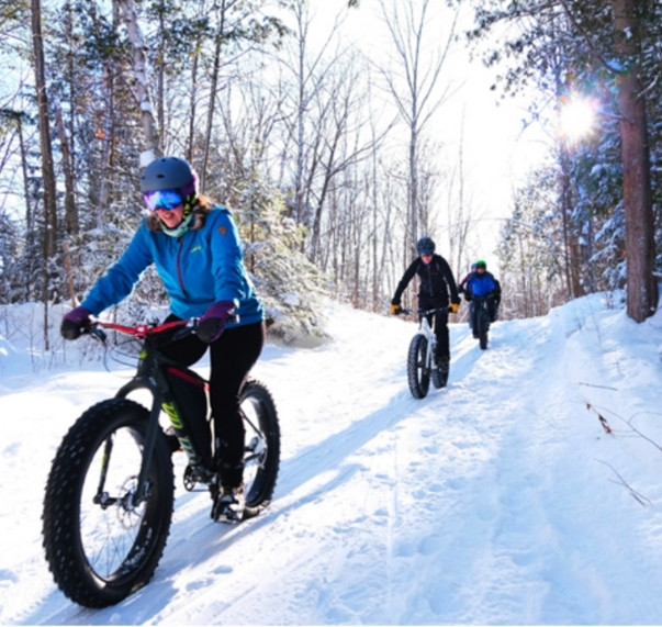 Fat bike on a snowy trail near Quebec City, boreal winter landscape
