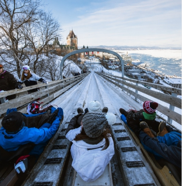 Dufferin Terrace toboggan slides in winter, with Château Frontenac in the background