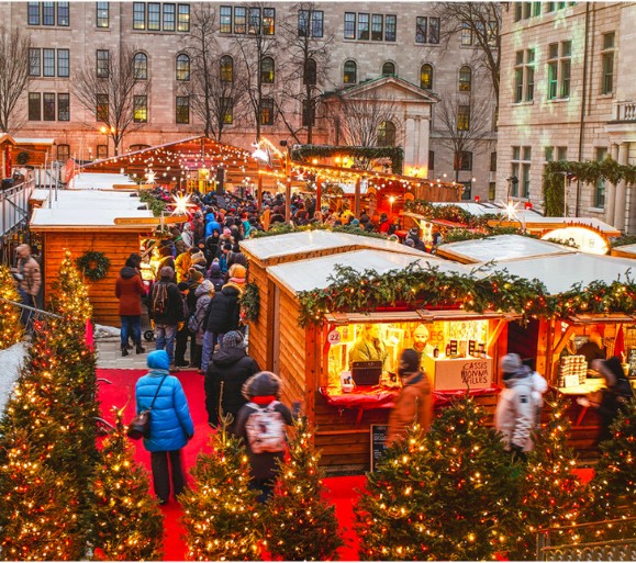 Quebec City German Christmas Market in Old Québec, illuminated wooden chalets in the evening