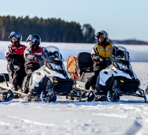 Snowmobile in a snow-covered boreal forest in the Charlevoix region, Quebec