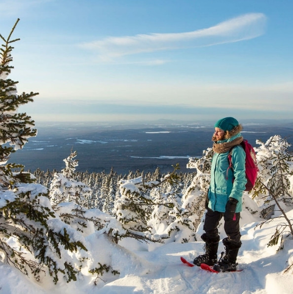 Snowshoe hike through a snow-covered winter landscape near Quebec City